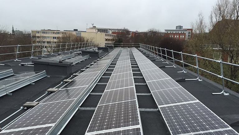 Solar PV system on a roof in Durham City, UK - public building solar panels project